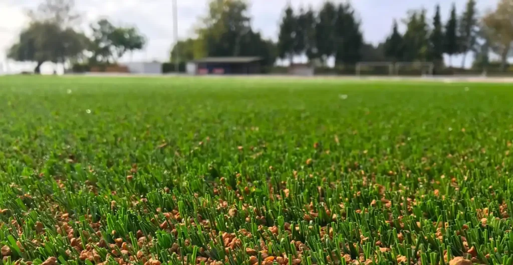 Close up of cork infill on a synthetic turf.